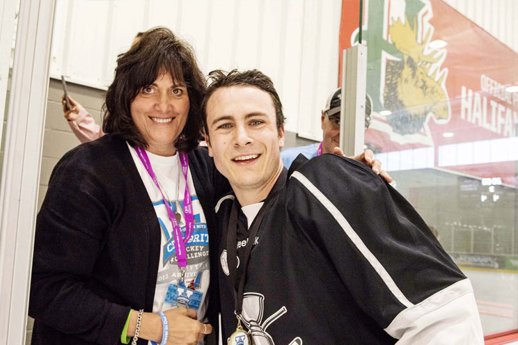 Debbie Boyd congratulates JBCHC participant on the ice