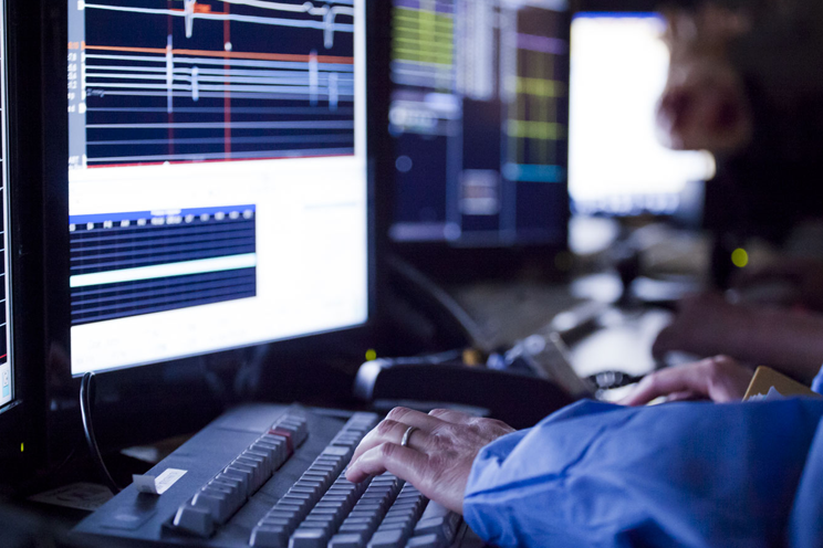 A doctor is working on a computer