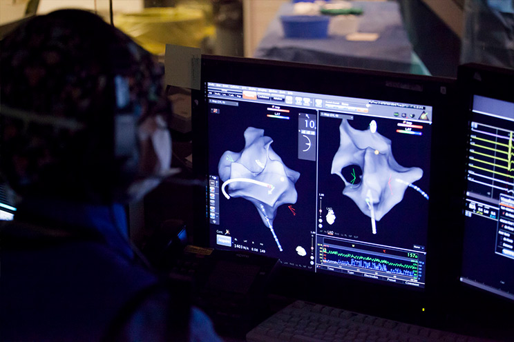 Surgeon examining screen 