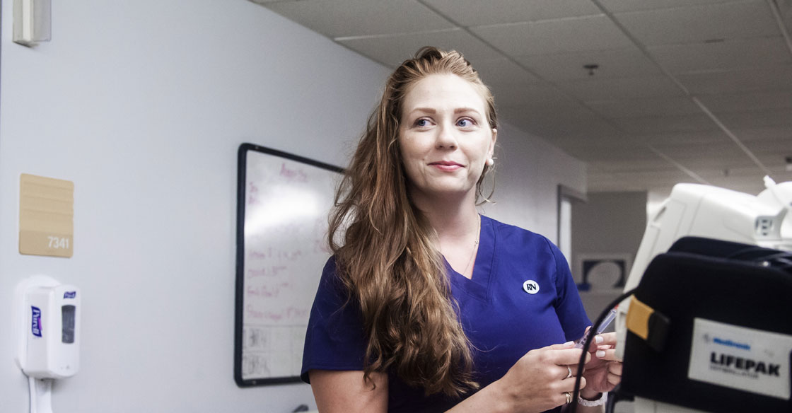 Nurse looks down the hallway