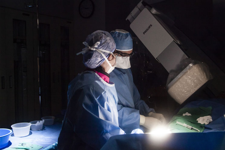 Surgeons perform surgery at the QEII