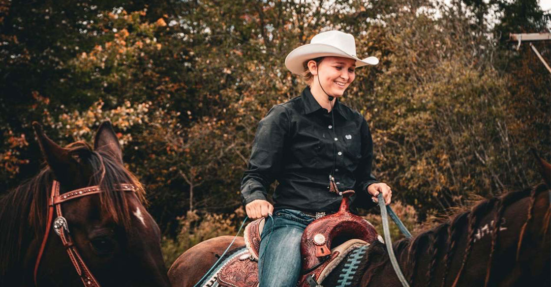 Hope Singer riding her horse, Suds