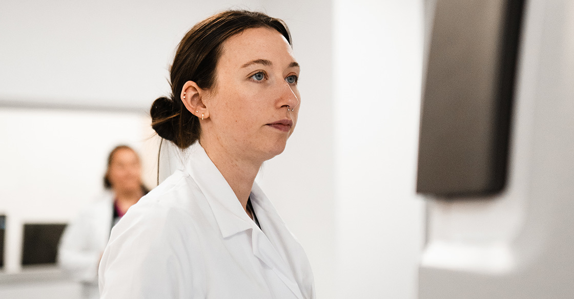 Person in white lab coat