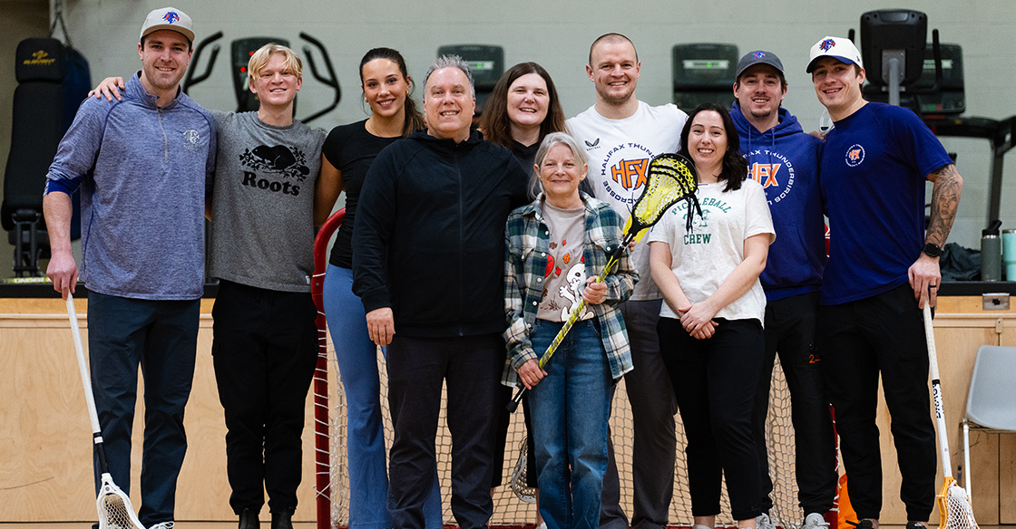 Group photo of lacrosse players and mental health care teams
