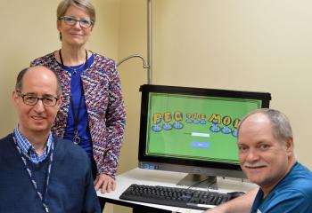 Dr. Gail Eskes (centre), Dalhousie University professor and researcher, Dr. Richard Braha (left), program manager for the QEII’s Acquired Brain Injury program, and Dave Kay (right)