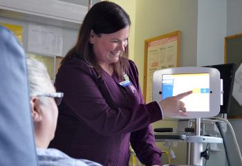 Interpreter on Wheels being used bedside