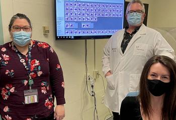 Kimberly Ingalls (left), technical specialist for microscopy, Dr. David Conrad (centre), hematopathologist, and Dr. Tish O’Reilly (right), 