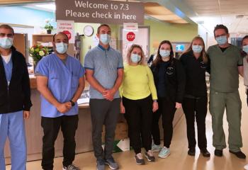 Dr. Sean Barry stands with neurosurgery team.