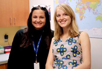 Amy Legate and Dr. Christine Campbell are smiling and standing in a medical office