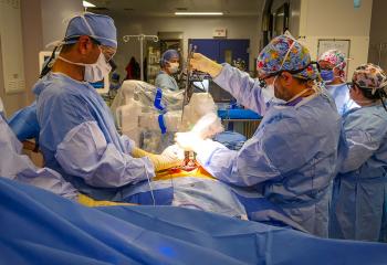 Live surgery shot showing the first spinal robotic patient procedure within a QEII operating room
