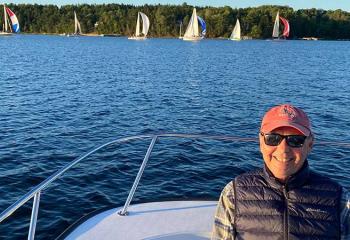 Picture of Paul on a boat, with the water behind him