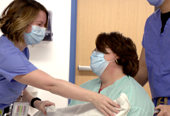 QEII staff covers patient with a blanket