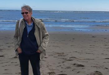 David Ferrigno standing on a beach