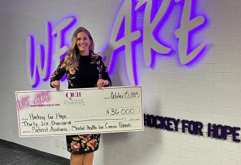 Shay Needham pictured with $36,000 cheque