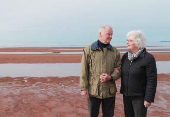 Stan and Helen Buell strolling the shores of PEI.