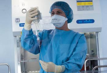 Doctor at the cancer therapy preparation lab