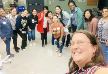 Dr. Tara Sampalli (fifth from left), pauses for a photo with a group of internationally educated nurses