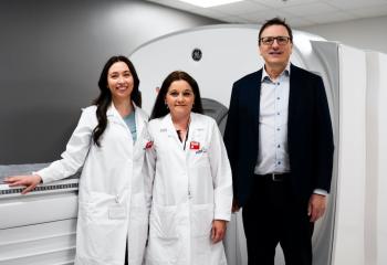 Dr. Steven Burrell (right), Sara Amero (left) and Alicia Burke (centre) with Canada’s first StarGuide Hybrid SPECT/CT nuclear medicine scanner