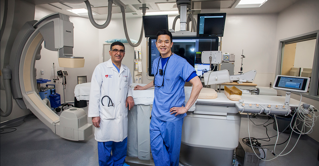 Dr. Hussein Beydoun (left) and Dr. Tony Lee (right) in Cardiac Cath Lab D.