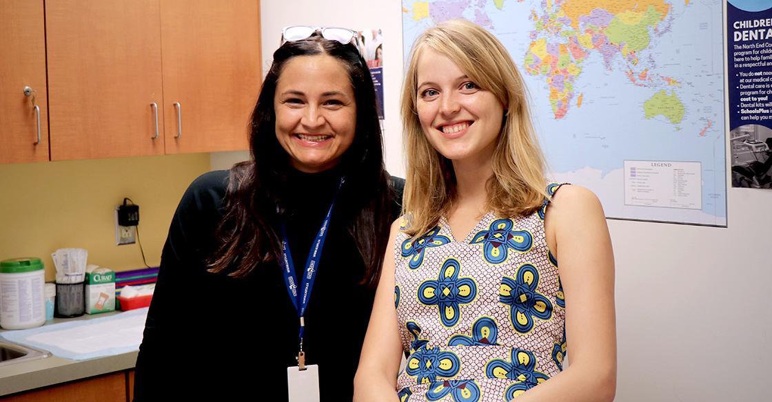 Amy Legate and Dr. Christine Campbell are smiling and standing in a medical office