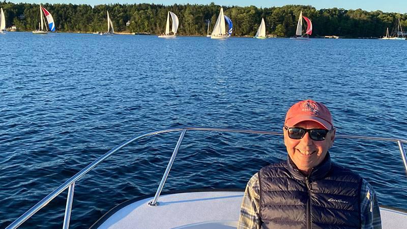 Picture of Paul on a boat, with the water behind him