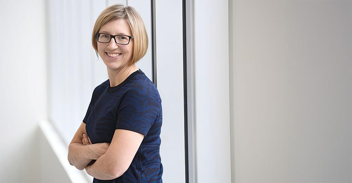 Dr. Robin Urquhart stands with her arms crossed