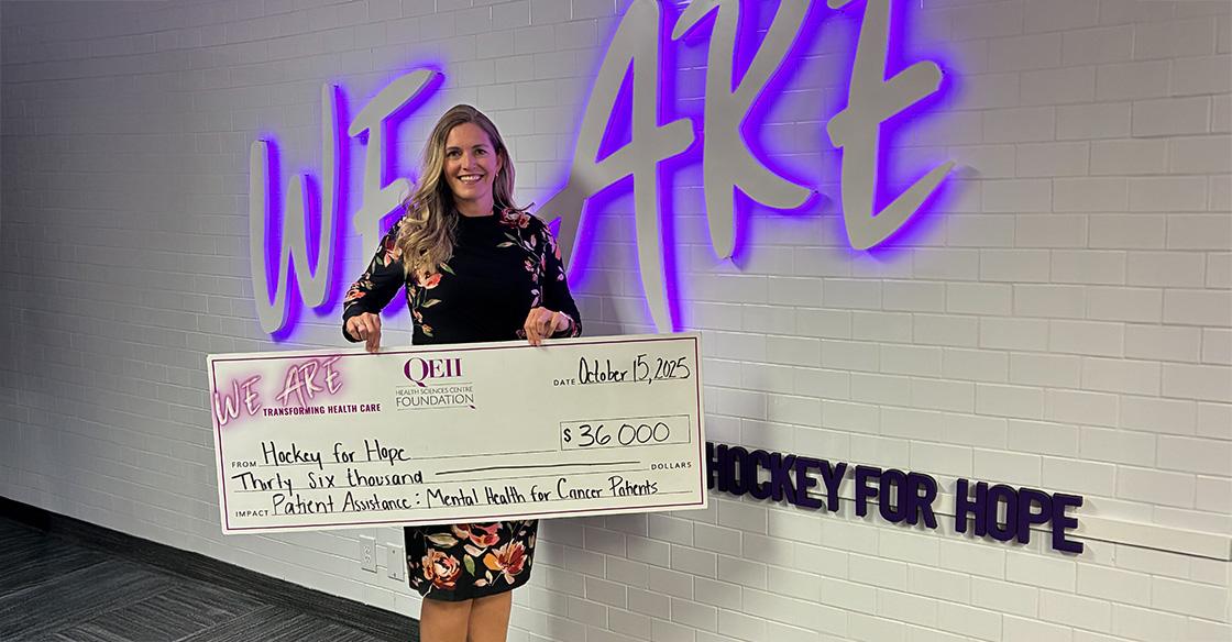 Shay Needham pictured with $36,000 cheque