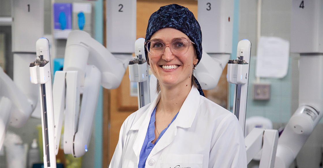 Dr. Lana Šačiragić stands with the da Vinci Xi surgical robot at the QEII. 