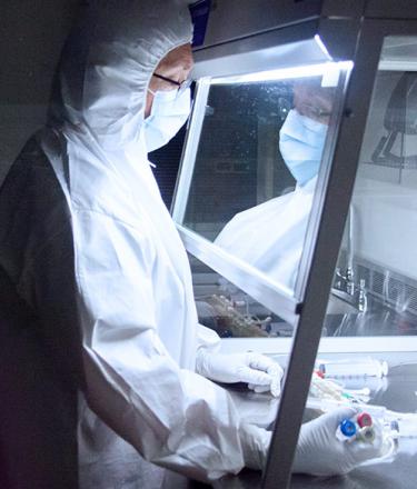 Pharmacy technician preparing cancer doses