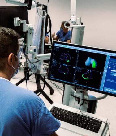 Doctors using ortho robot in an operating room