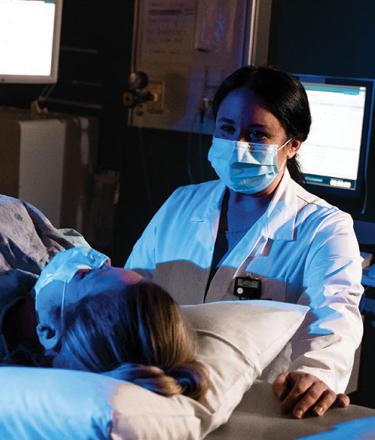 doctor and patient at the nuclear medicine scanner