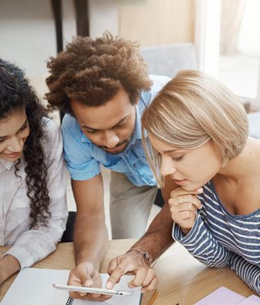 Three youth discussing new ideas