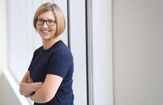Dr. Robin Urquhart stands with her arms crossed