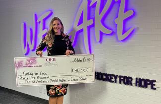 Shay Needham pictured with $36,000 cheque