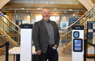 Dean Stienburg, director of security, stands by the AI security scanners.