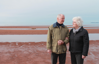Stan and Helen Buell strolling the shores of PEI.