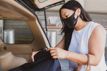 woman getting things out of her trunk