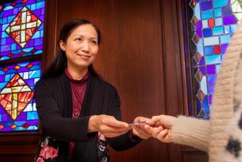 Helen Chan, giving gift card to patient