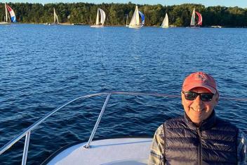 Picture of Paul on a boat, with the water behind him