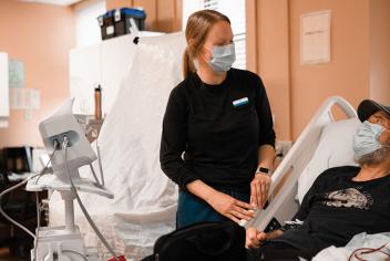 a healthcare professional chatting with a patient